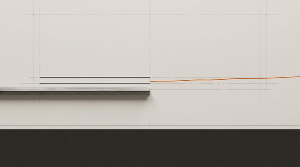 Two lines on a drafting table. One ruled in dark ink, ending cleanly. One drawn freehand in survey-marker orange, continuing past the edge of the frame.